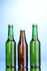 bottles of beer on blue background