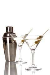 Martini glasses with olives and shaker isolated on white