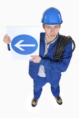 Worker with a one way sign