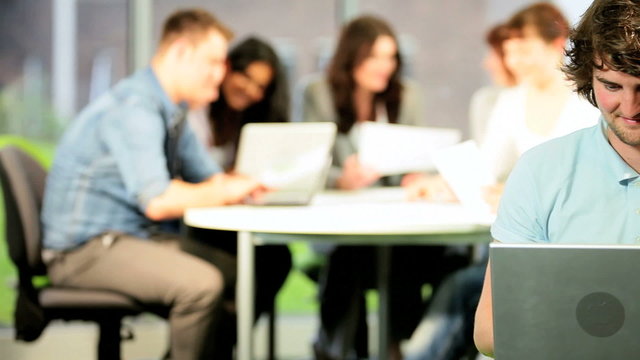 Portrait of student e-learning  on computer with college