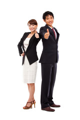 Business couple showing thumb.