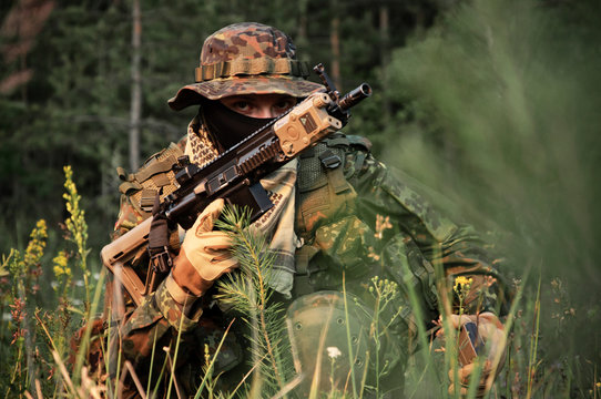 A Soldier Of German Special Forces Reloading