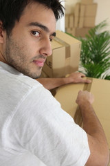 Man packing moving box
