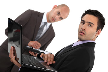 Businessmen with a diary and laptop