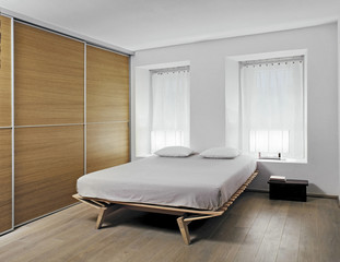 moderna camera da letto con armadio di legno