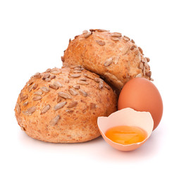 Bun with seeds and broken egg