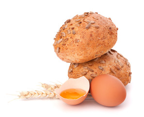 Bun with seeds and broken egg