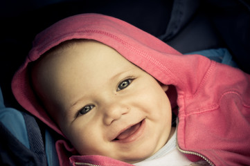 Baby with pink hood