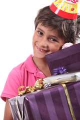 child with birthday gifts