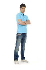 Young man standing with his arms folded
