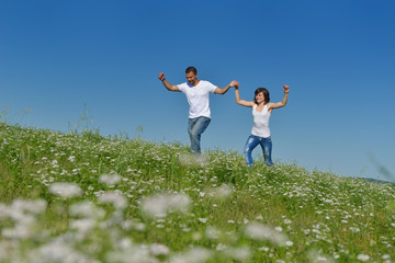 Fototapeta na wymiar happy couple in wheat field