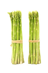 Two green asparagus isolated on white