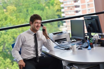 happy young business man at office