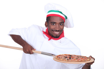 Italian chef with a pizza on a wooden peel