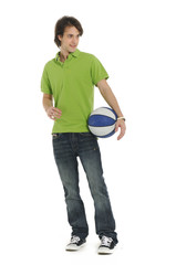 Young man holding basketball in hand