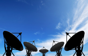 satellite dish antennas under blue sky with white cloud
