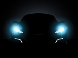 The car in the dark with the included headlights.