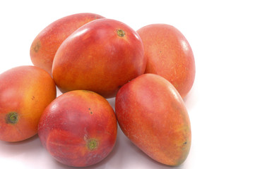 Fototapeta na wymiar Stacked ripe mangoes
