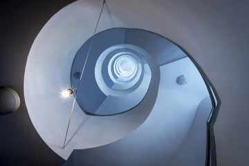 Raamstickers Modern spiral staircase, view from down © Cinematographer