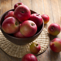Apples on a rustic kitchen table at morning light