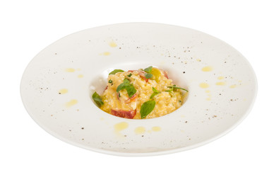 photo of delicious risotto dish with herbs and tomato on white b