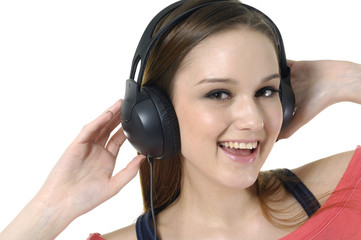 Close up women listening music in headphones