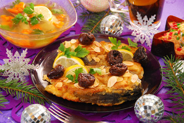 fried carp with almonds and prune for christmas
