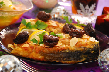 fried carp with almonds and prune for christmas
