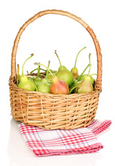 ripe pears in basket isolated on white.