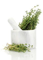 mortar with fresh green thyme isolated on white