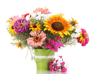 Beautiful bouquet of bright flowers in pail isolated on white