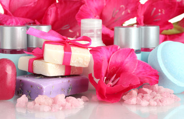 cosmetic bottles, soap and flowers
