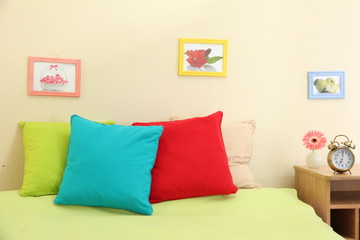 Empty bed with pillows and sheets in bedroom