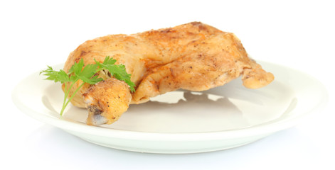 roasted chicken leg with parsley in the plate isolated on white