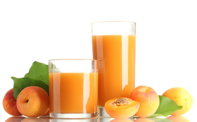 two glasses of apricot juice and apricots with leaves isolated