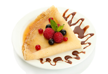Delicious pancakes with berries,chocolate and honey