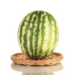 Ripe watermelon on wicker mat isolated on white