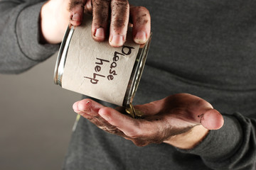 homeless pours money from bank, close-up
