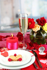 Table setting in honor of Valentine's Day on room background