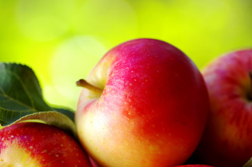 .ripe red apples on table