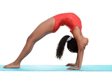 South African child doing gymnastics bridge