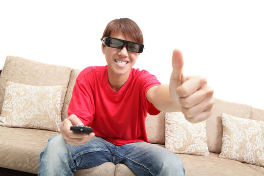 man wearing 3d glasses watch tv and thumb up
