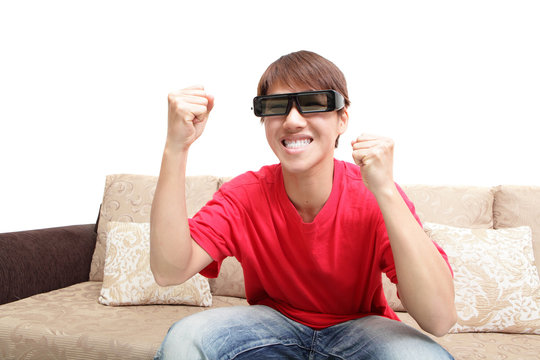 man wearing 3d glasses watch tv