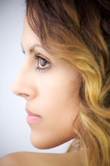 Fototapeta premium Beautiful profile of young woman with big eyes and lips