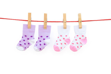 two pairs baby socks hanging with clipping path