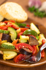 Ratatouille made of eggplant, zucchini, bell pepper and tomato
