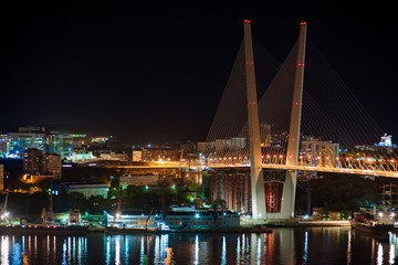 night view of the bridge in the Russian Vladivostok over the Gol © GLandStudio
