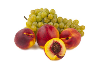 ripe peach with grapes isolated