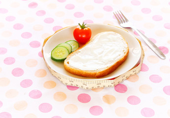 diet concept - sliced bread with cream cheese and vegetables