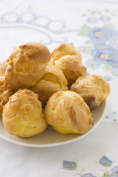 Choux buns on a white plate